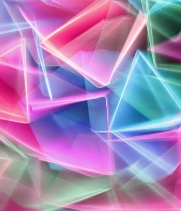 Abstract glowing geometric shapes representing energy and movement